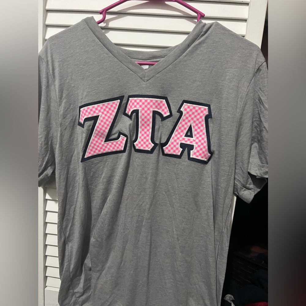 Zeta tau alpha stitched letter shirt. Worn once. Fits small and medium.